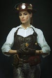 Steampunk hermoso de la muchacha Presentación con el reloj Foto de archivo Steampunk hermoso de la muchacha Presentación con el reloj Foto de archivo