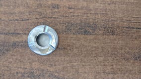 Steel metal empty ashtray on a beige table. View from above royalty free stock photos Steel metal empty ashtray on a beige table. View from above royalty free stock photos