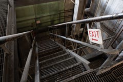 Steel Staircase with Exit Sign - Abandoned Coal Power Plant - New York stock image Steel Staircase with Exit Sign - Abandoned Coal Power Plant - New York stock image