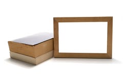 Sterta książka z drewnianą fotografii ramą obrazy stock Sterta książka z drewnianą fotografii ramą obrazy stock