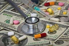 Stethoscope with hypodermic syringe and doze of medical tablets Stock Photos Stethoscope with hypodermic syringe and doze of medical tablets Stock Photos