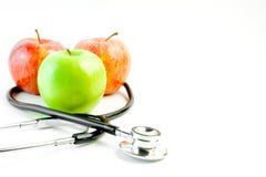 Stetoscopio medico e tre mele immagini stock Stetoscopio medico e tre mele immagini stock