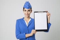 Stewardess Dressed In Blue Uniform with empty blank in hands Royalty Free Stock Images Stewardess Dressed In Blue Uniform with empty blank in hands Royalty Free Stock Images