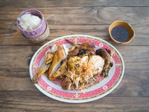 Sticky rice and grilled chicken with dipping sauce on wooden tab royalty free stock photography Sticky rice and grilled chicken with dipping sauce on wooden tab royalty free stock photography