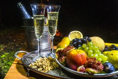 Still life with champagne on the background of fire Stock Photo Still life with champagne on the background of fire Stock Photo