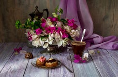 Two cakes, a bouquet of flowers and a cup of coffee Stock Image Two cakes, a bouquet of flowers and a cup of coffee Stock Image