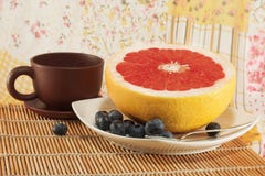 Still-life With A Diet Breakfast: Grapefruit, Blueberries And Some Coffee Stock Image Still-life With A Diet Breakfast: Grapefruit, Blueberries And Some Coffee Stock Image