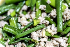 Stir fried Chinese Chives with pork, Pork Chops With Flowering Garlic Chives stock images Stir fried Chinese Chives with pork, Pork Chops With Flowering Garlic Chives stock images