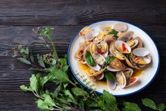 Stir fried Spicy Clam (Surf clam, Short necked clam, Carpet clam, Venus shell, Baby clam) with Thai Holy Basil