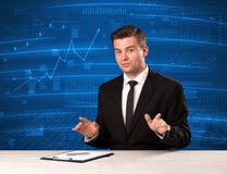 Stock data analyst in studio giving adivce on blue chart background royalty free stock image Stock data analyst in studio giving adivce on blue chart background royalty free stock image