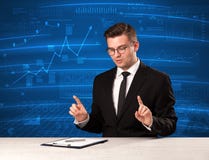 Stock data analyst in studio giving adivce on blue chart background stock images Stock data analyst in studio giving adivce on blue chart background stock images
