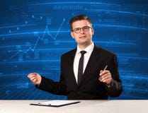Stock data analyst in studio giving adivce on blue chart background stock photos Stock data analyst in studio giving adivce on blue chart background stock photos