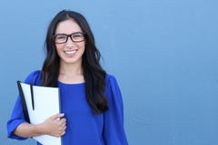 Stock image of female college student isolated on blue background Royalty Free Stock Photos Stock image of female college student isolated on blue background Royalty Free Stock Photos