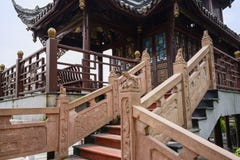 Stone balustrades with bas-relief and sculptures of Chinese pavilion stock image Stone balustrades with bas-relief and sculptures of Chinese pavilion stock image