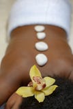 Beautiful woman having a wellness hot stone back massage royalty free stock photo Beautiful woman having a wellness hot stone back massage royalty free stock photo