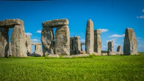 Stonehenge UNESCO Heritage in the UK side view behind green field royalty free stock image Stonehenge UNESCO Heritage in the UK side view behind green field royalty free stock image