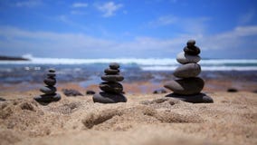 Stones balance on vintage beach, inspirational summer. Picturesque sea landscape. Tenerife. Ocean. Sea waves. Beach. Great place for meditation Stones balance on vintage beach, inspirational summer. Picturesque sea landscape. Tenerife. Ocean. Sea waves. Beach. Great place for meditation