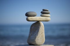 Stones pile background. Scales balance. Balanced stones on the top of boulder. Decide problem. To weight pros and cons.