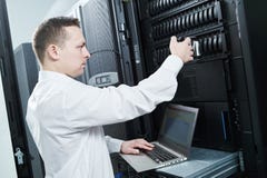 Storage maintenance. Service engineer in server room stock images Storage maintenance. Service engineer in server room stock images