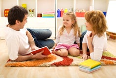 Story time - happy family with a child stock photography Story time - happy family with a child stock photography