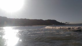 Strand mit der Sonne, die in der Ecke scheint lizenzfreies stockfoto Strand mit der Sonne, die in der Ecke scheint lizenzfreies stockfoto