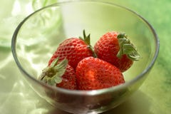 Strawberries In Aglass Bowl With Reflections Stock Image