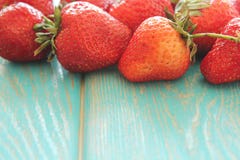 Strawberries on wooden blue desk. stock photography Strawberries on wooden blue desk. stock photography