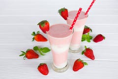 Strawberry smoothies yogurt, juice and strawberry fruit for breakfast in the morning on white wood background. royalty free stock photos Strawberry smoothies yogurt, juice and strawberry fruit for breakfast in the morning on white wood background. royalty free stock photos