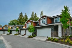Street of brand new residential triplex houses ready for moving in royalty free stock image Street of brand new residential triplex houses ready for moving in royalty free stock image