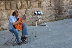 Street musician is playing on his flamenco guitar. stock photos Street musician is playing on his flamenco guitar. stock photos