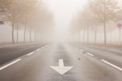 Street with reduced visibility due to fog Royalty Free Stock Photos Street with reduced visibility due to fog Royalty Free Stock Photos