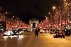 Street View At The Triumphal Arch And Champs Elysees Avenue Illuminated For Christmas Royalty Free Stock Image