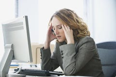 Stressed Businesswoman Working in Office