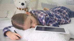 Stressed Child Sleeping while Studying, Kid Asleep Writing Homework on Tablet royalty free stock image Stressed Child Sleeping while Studying, Kid Asleep Writing Homework on Tablet royalty free stock image