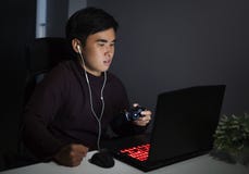 Stressed depressed man using joystick to playing games Stock Photo Stressed depressed man using joystick to playing games Stock Photo