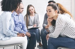 Stressed thoughtful woman during group rehab therapy royalty free stock photo Stressed thoughtful woman during group rehab therapy royalty free stock photo