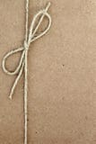 String Bow on Brown Paper