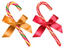Striped candy cane with bow isolated over white, clipping path Royalty Free Stock Image Striped candy cane with bow isolated over white, clipping path Royalty Free Stock Image