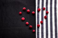 Strips and raspberry on the texture of the fabric stock photos Strips and raspberry on the texture of the fabric stock photos