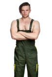 Strong caucasian man in coverall with folded hands. royalty free stock photos Strong caucasian man in coverall with folded hands. royalty free stock photos