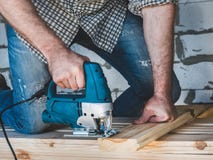 Strong men`s hands and tools stock image Strong men`s hands and tools stock image