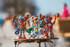 Strongman figurines made from bottle caps and sold on the promenade next to the beach by a loca Stock Images Strongman figurines made from bottle caps and sold on the promenade next to the beach by a loca Stock Images