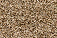 Struttura di un tappeto beige con un grande pelo fotografie stock libere da diritti Struttura di un tappeto beige con un grande pelo fotografie stock libere da diritti