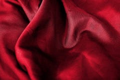 Struttura rossa astratta del fondo del tessuto Onde del materiale del velluto del raso fotografia stock libera da diritti Struttura rossa astratta del fondo del tessuto Onde del materiale del velluto del raso fotografia stock libera da diritti