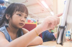 Student learning how to use tablet in classroom stock photography Student learning how to use tablet in classroom stock photography