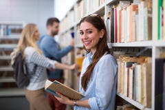 Students working in the library at campus Royalty Free Stock Image Students working in the library at campus Royalty Free Stock Image