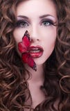 Studio beauty portrait with red butterfly royalty free stock images Studio beauty portrait with red butterfly royalty free stock images