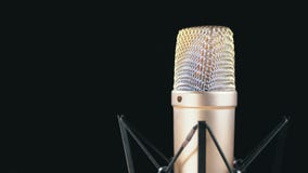 Studio Microphone with Spider Rotates on a Black Background stock video footage Studio Microphone with Spider Rotates on a Black Background stock video footage