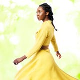 Studio portrait of African woman in yellow dress. Stock Images Studio portrait of African woman in yellow dress. Stock Images