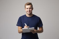 Studio Portrait Of Male Sports Coach With Clipboard stock photos Studio Portrait Of Male Sports Coach With Clipboard stock photos